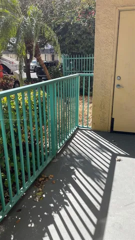 a kitchen with a stove a sink and a microwave
