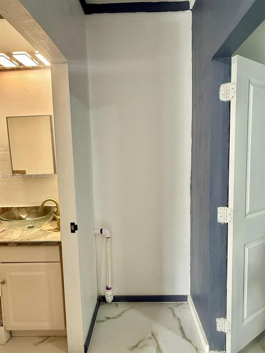 10357 Southwest 174th Terrace, Unit 1 Miami, FL 33157 - Photo 6 of 7 a view of bathroom with a granite countertop sink