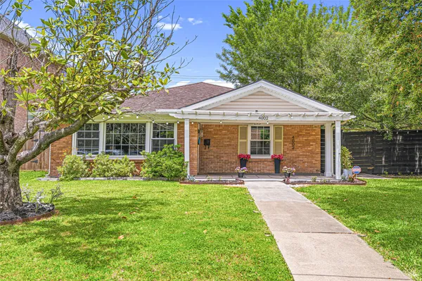 a front view of a house with a yard and porch