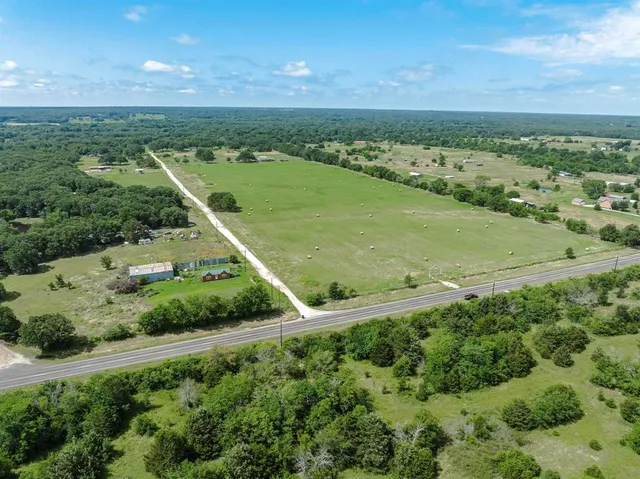 a view of a green field with clear sky