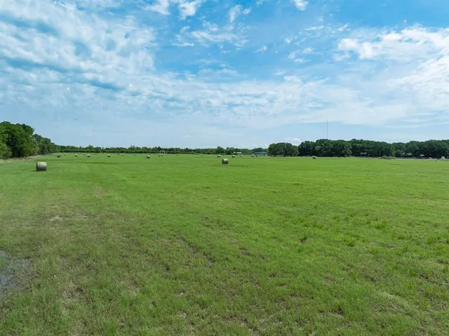 a view of a golf course with a lake