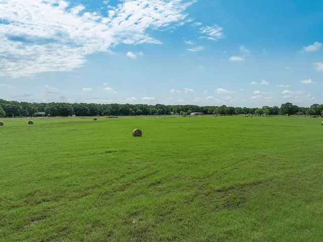 a view of a golf course with a lake view