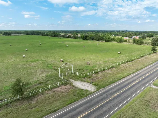 a view of a green field with clear sky