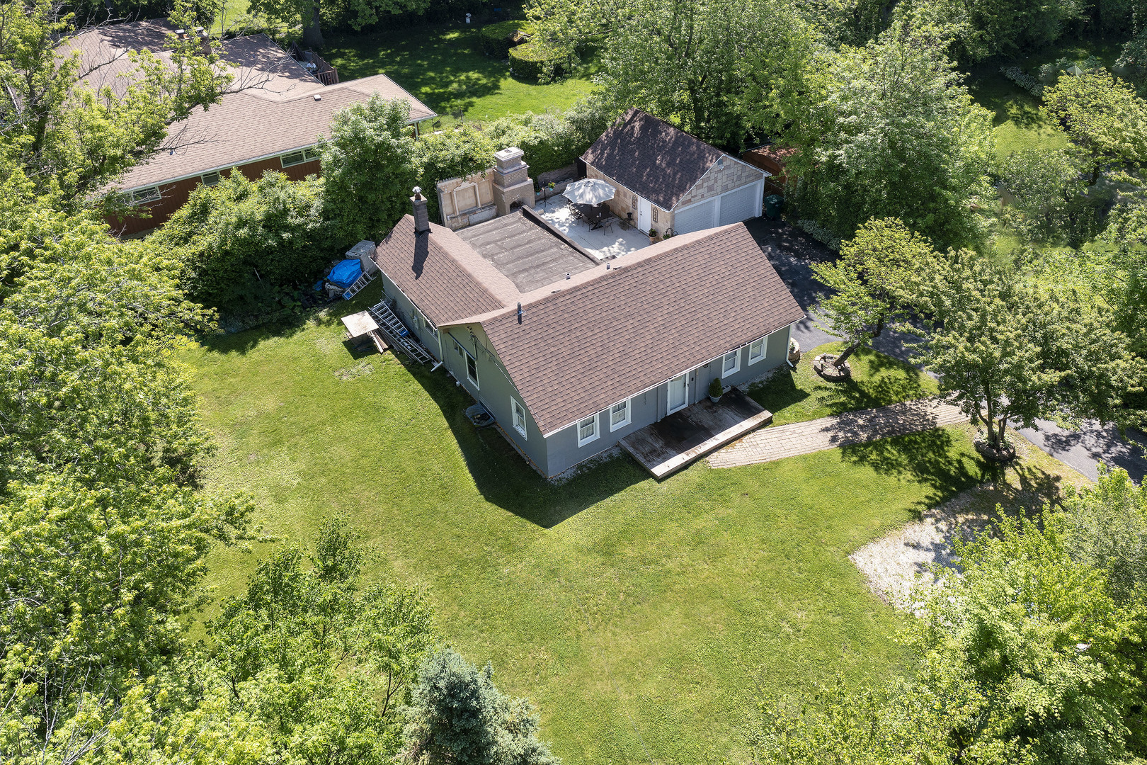 2015 Greenview Road Northbrook, IL 60062 - Photo 10 of 11 an aerial view of a house with swimming pool and large trees