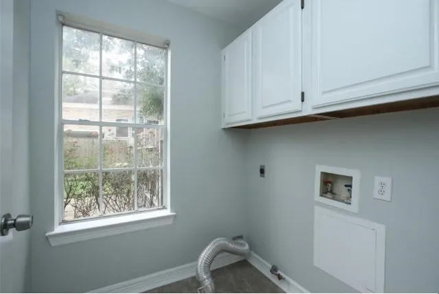 a kitchen with stainless steel appliances granite countertop a refrigerator stove and sink