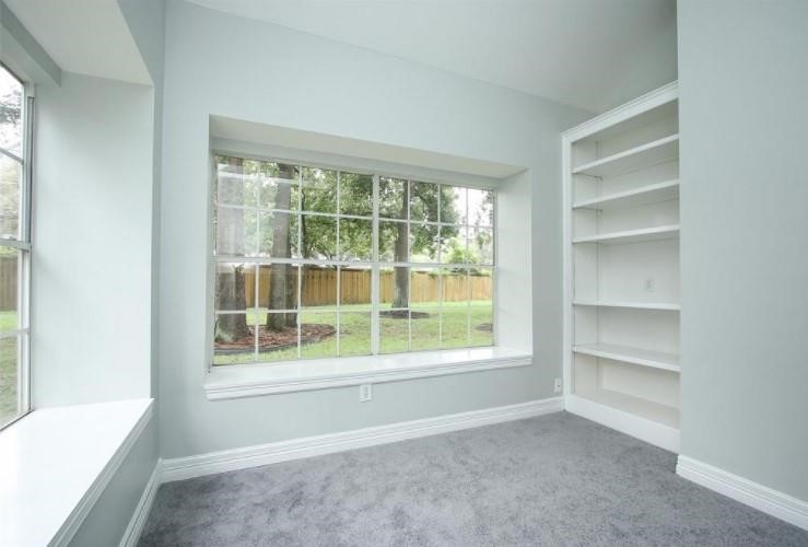 16222 Morningbrook Drive Spring, TX 77379 - Photo 21 of 44 a view of an empty room with a window