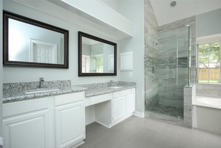16222 Morningbrook Drive Spring, TX 77379 - Photo 22 of 44 a bathroom with a granite countertop sink mirror and double