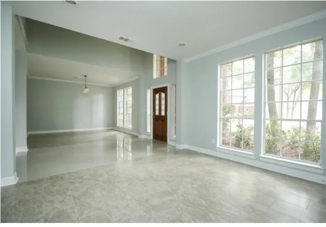 a view of an empty room with a window