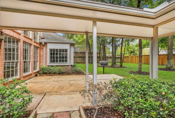 16222 Morningbrook Drive Spring, TX 77379 - Photo 36 of 44 a view of a house with backyard and porch