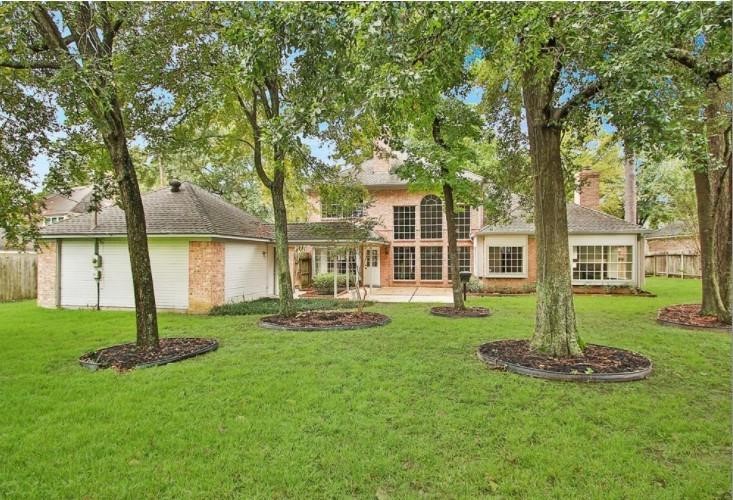 16222 Morningbrook Drive Spring, TX 77379 - Photo 39 of 44 a view of a house with backyard and a tree