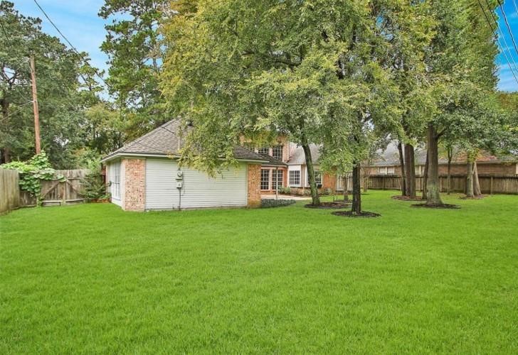 16222 Morningbrook Drive Spring, TX 77379 - Photo 40 of 44 a view of a yard with a house and garden