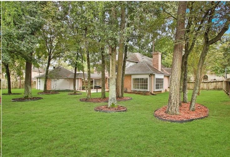 16222 Morningbrook Drive Spring, TX 77379 - Photo 41 of 44 a front view of a house with a garden