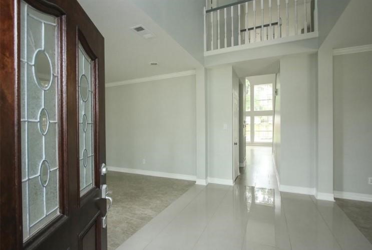 16222 Morningbrook Drive Spring, TX 77379 - Photo 6 of 44 a view of a hallway with entryway door