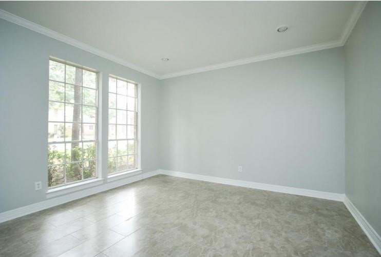 16222 Morningbrook Drive Spring, TX 77379 - Photo 9 of 44 an empty room with windows