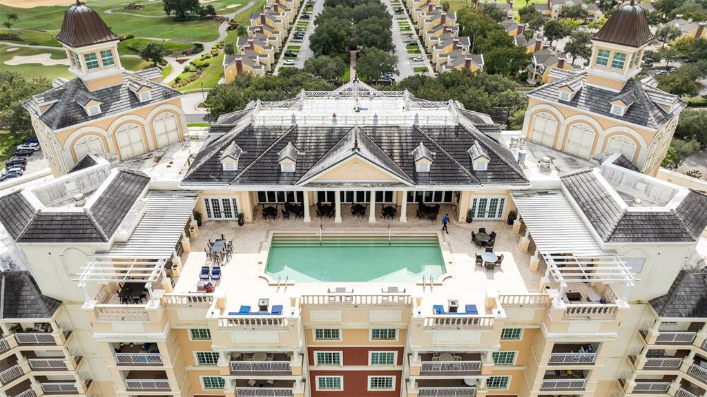 7593 Gathering Drive, Unit 501 Reunion, FL 34747 - Photo 2 of 38 a view of a big white building