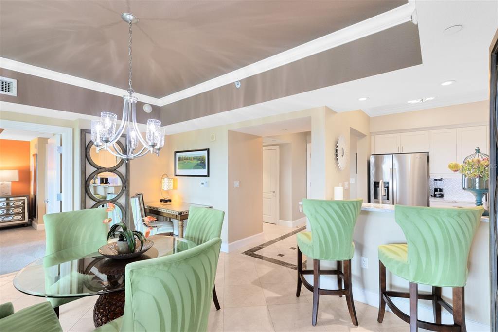 7593 Gathering Drive, Unit 501 Reunion, FL 34747 - Photo 10 of 38 a living room with furniture and a chandelier