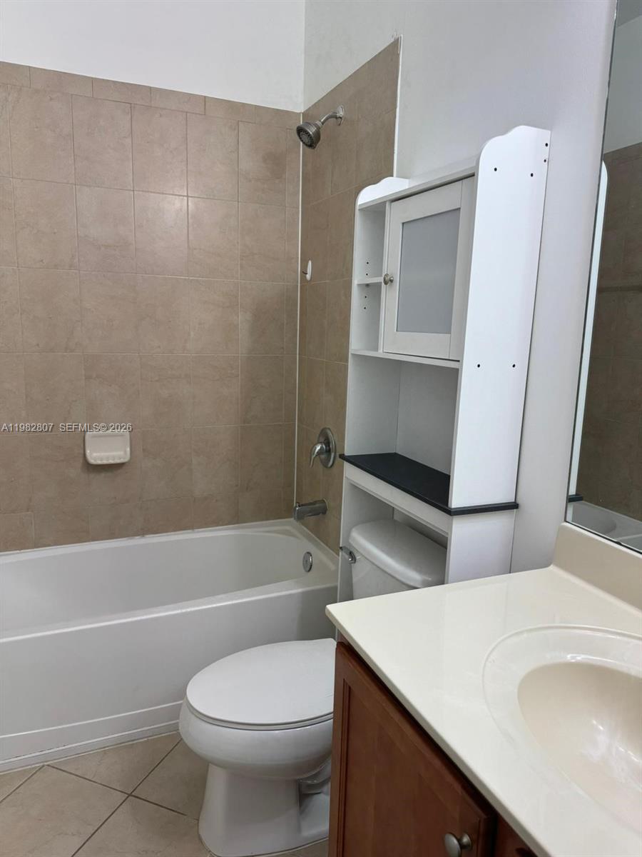 4217 Southwest 164th Court Miami, FL 33185 - Photo 11 of 15 a bathroom with a sink a toilet and shower