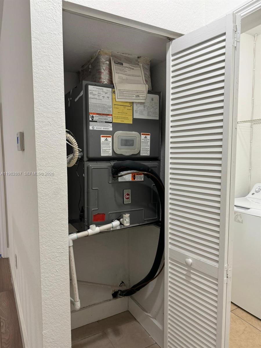 4217 Southwest 164th Court Miami, FL 33185 - Photo 15 of 15 a room with storage and utility
