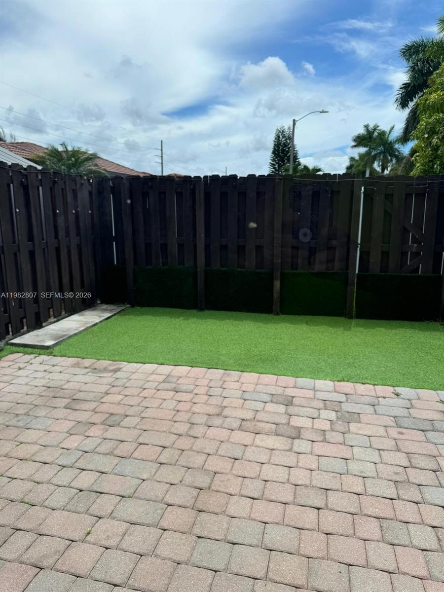4217 Southwest 164th Court Miami, FL 33185 - Photo 9 of 15 a view of a backyard with a small yard