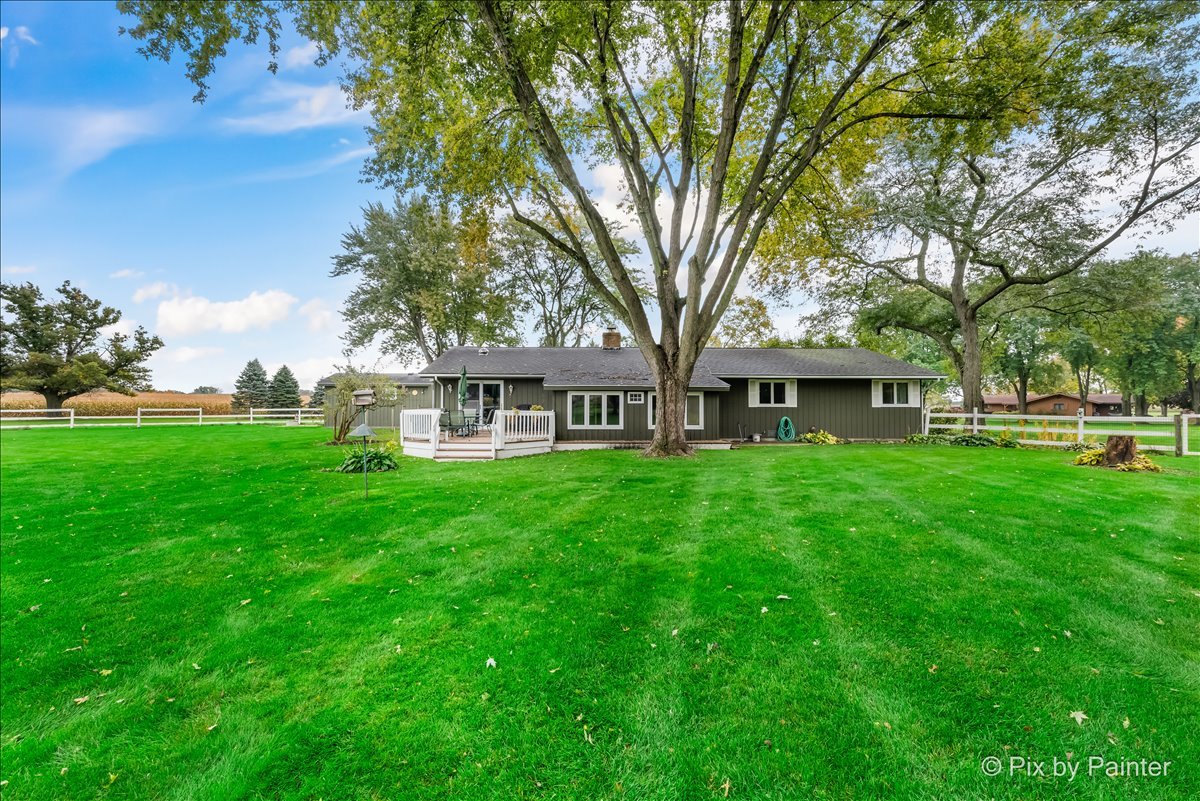 6709 Kemman Road Hebron, IL 60034 - Photo 4 of 4 a front view of a house with garden