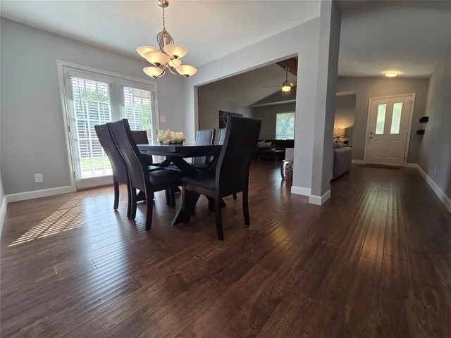 a kitchen with sink cabinets and wooden floor