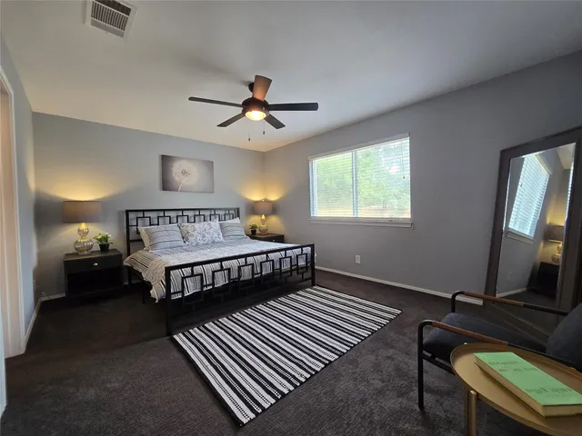 a bathroom with double sink and a mirror