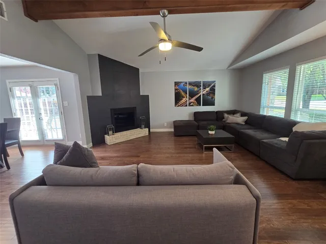 a living room with furniture and a fireplace