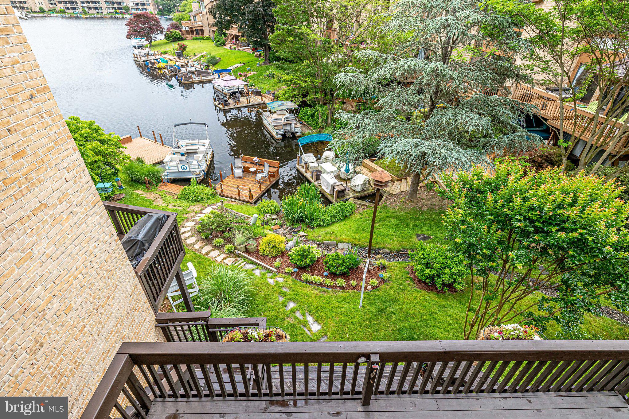 2024 Lakebreeze Way Reston, VA 20191 - Photo 41 of 95 View of the deck, lawn & lake from primary balcony