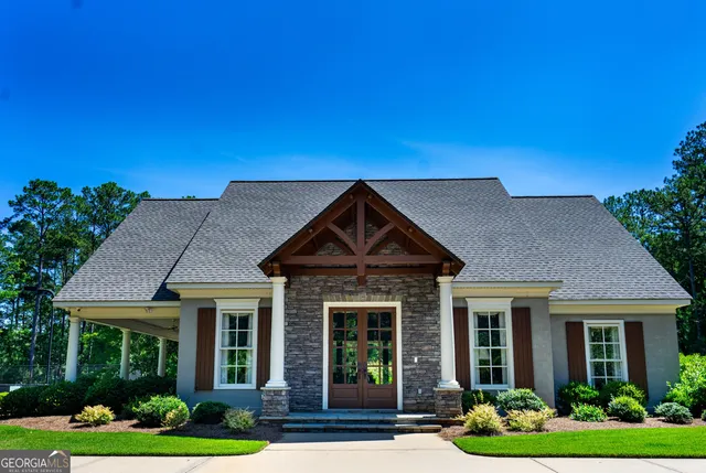 a front view of a house with garden