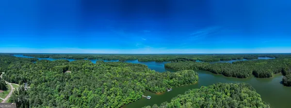 a view of a lake and green space