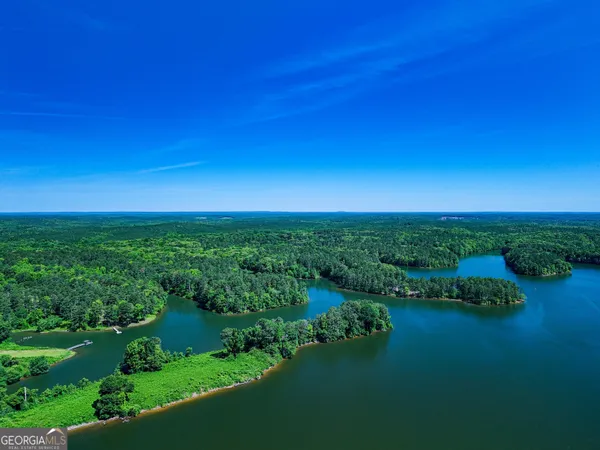 a view of a lake with a yard
