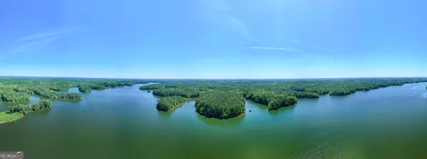 a view of a lake with green space