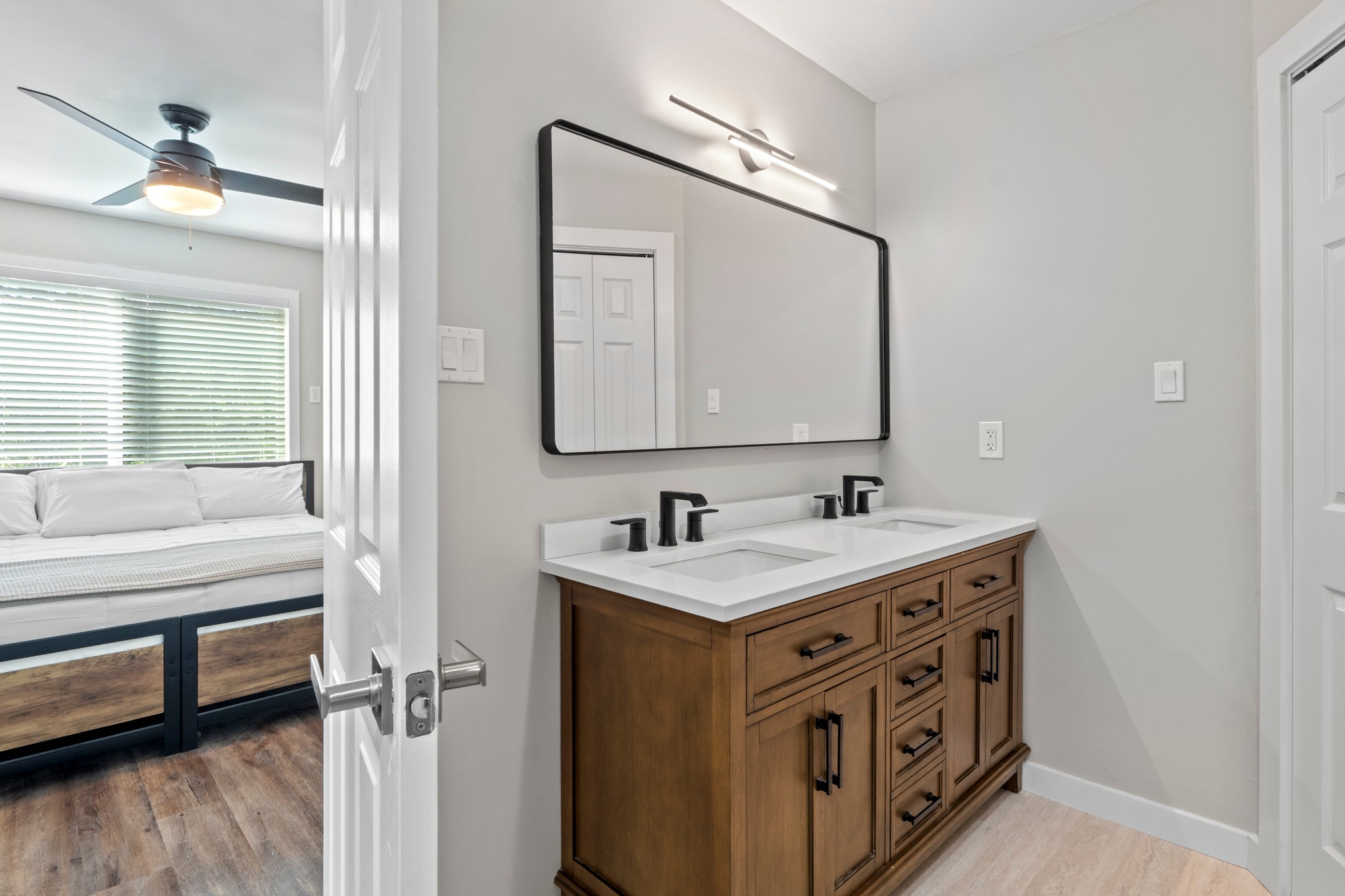 11811 Rotherham Drive Austin, TX 78754 - Photo 21 of 37 Double vanity with sleek fixtures creates a harmonious and functional bathroom retreat.