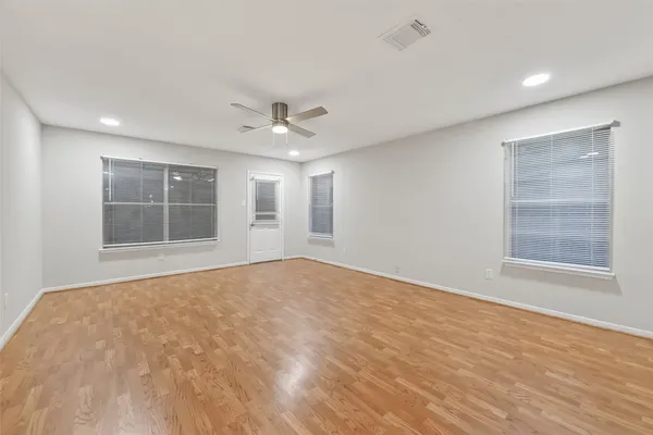 a view of an empty room with a window