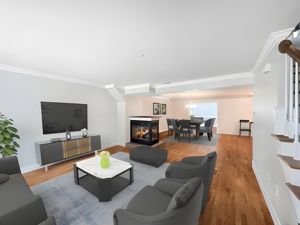 216 Rangeway Road, Unit 173 Billerica, MA 01862 - Photo 3 of 7 a living room with fireplace furniture and a flat screen tv