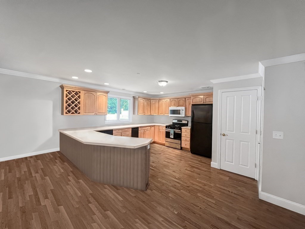 216 Rangeway Road, Unit 173 Billerica, MA 01862 - Photo 4 of 7 a large kitchen with a table and chairs
