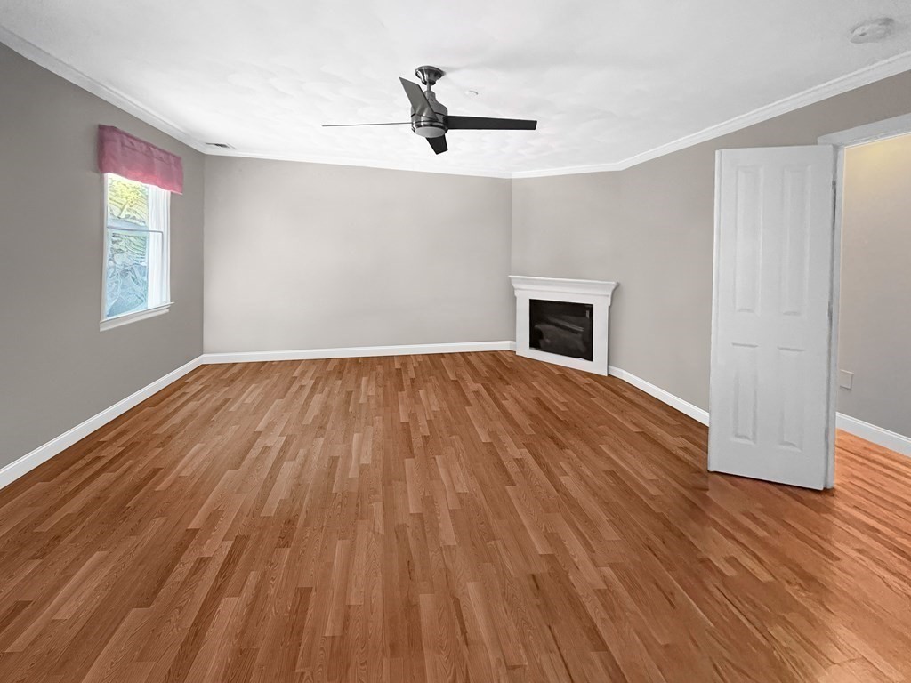 216 Rangeway Road, Unit 173 Billerica, MA 01862 - Photo 6 of 7 wooden floor in an empty room with a window