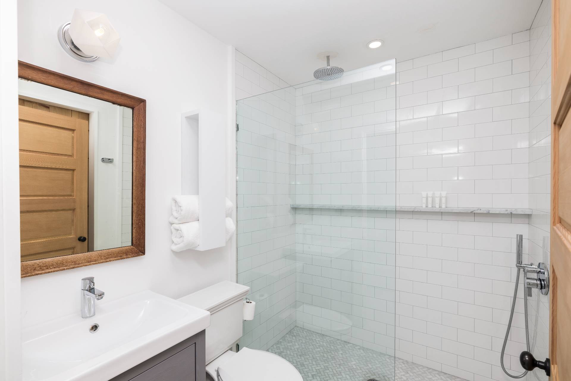 311 Town Line Road Wainscott, NY 11963 - Photo 19 of 39 a bathroom with a sink a toilet and shower