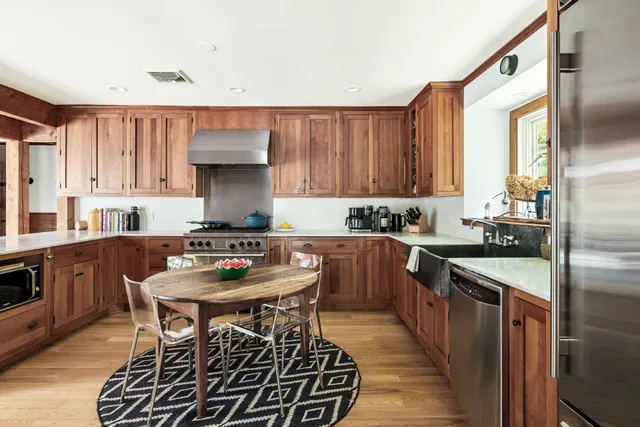 a spacious bedroom with a large bed and a balcony