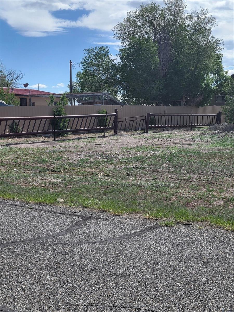 11575 2nd Avenue Hooper, CO 81136 - Photo 7 of 10 a view of a house with a yard