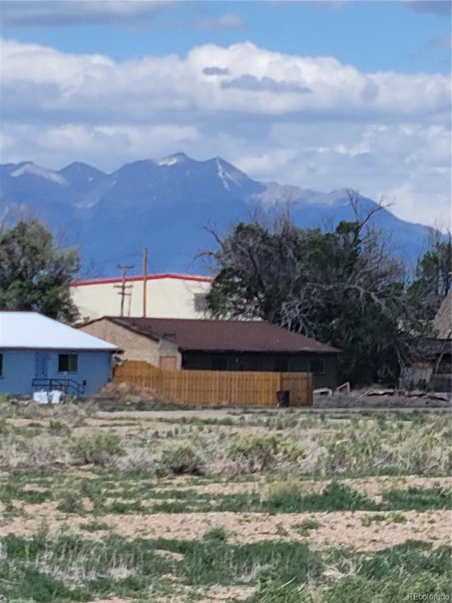 11575 2nd Avenue Hooper, CO 81136 - Photo 10 of 10 a view of a house with a yard and a forest