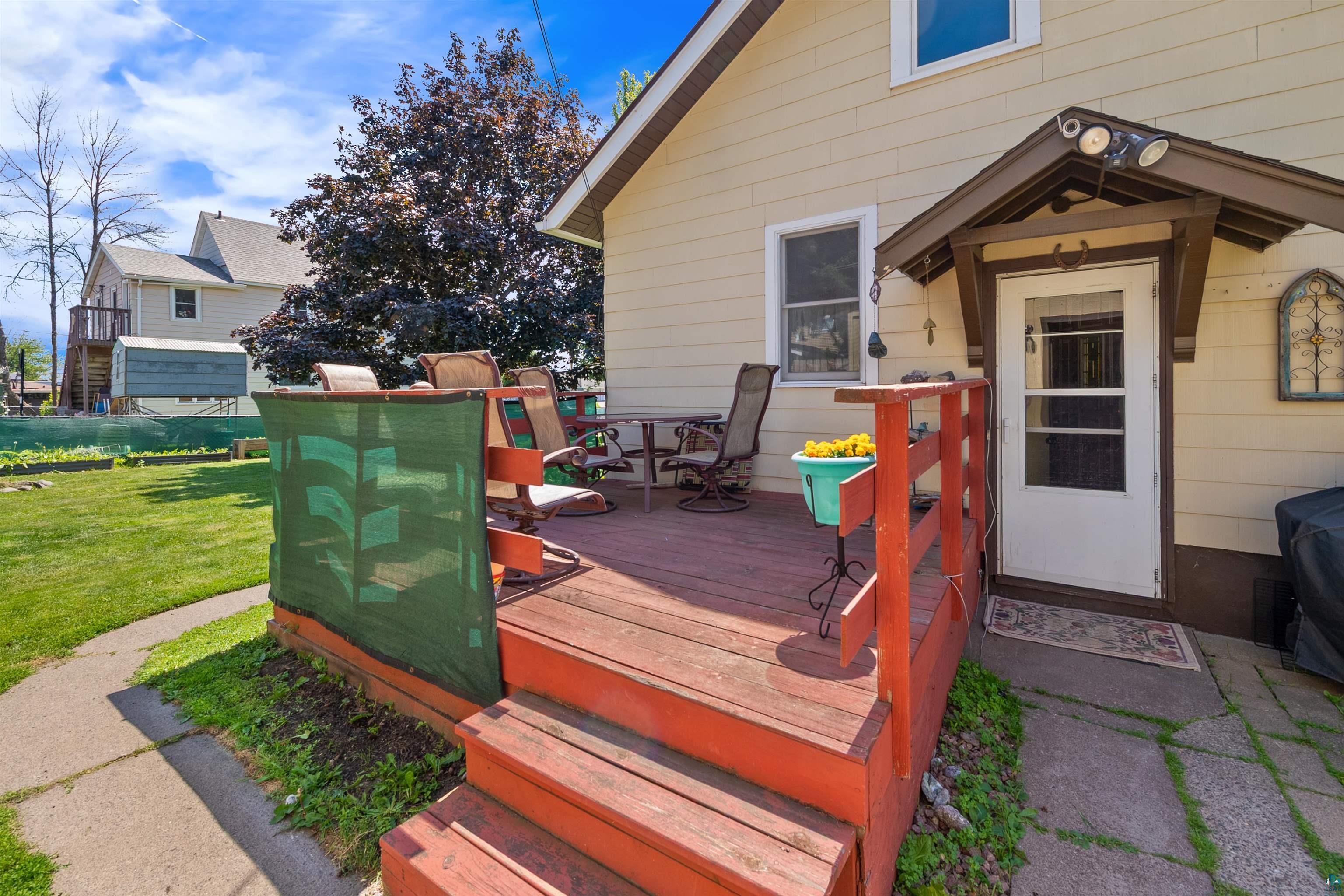 3209 Chestnut Street Duluth, MN 55806 - Photo 25 of 28 Exterior deck featuring a red-stained surface with matching railing, offering direct access to the interior