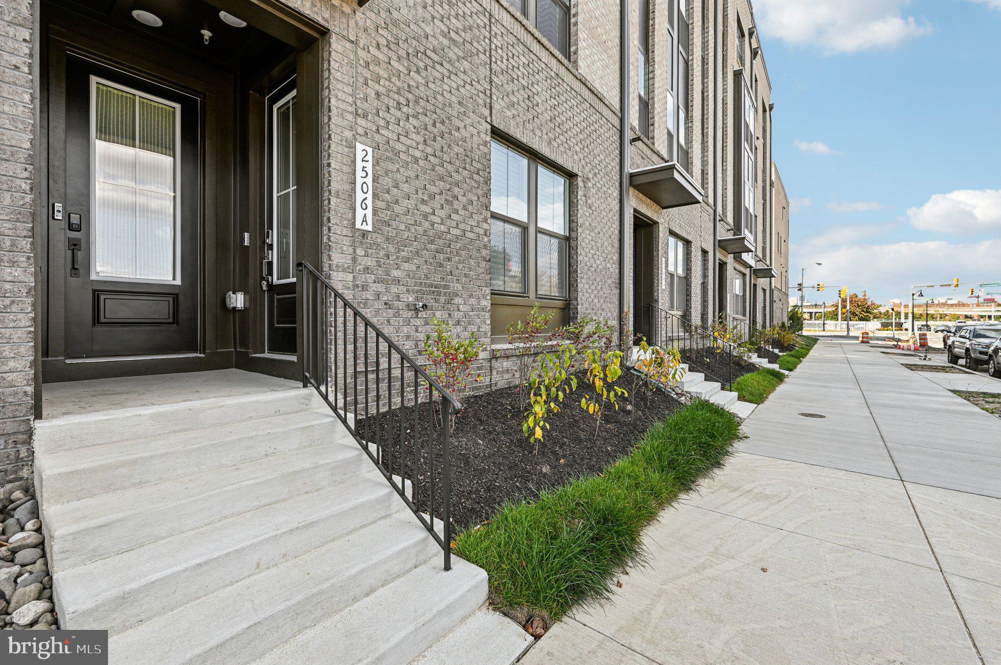 a view of a pathway both side of house