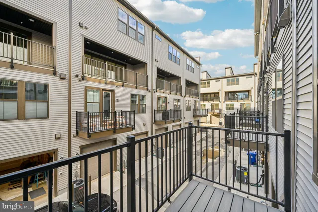 a view of a balcony with wooden floor