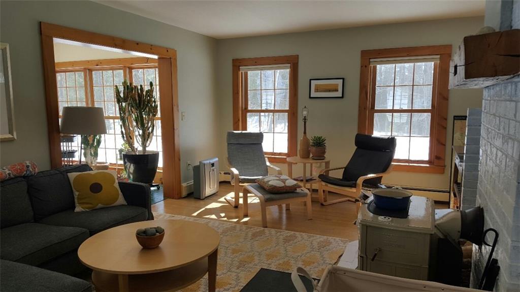 75 Marshall Pond Road Hebron, ME 04238 - Photo 15 of 35 Living room with hearth and woodstove