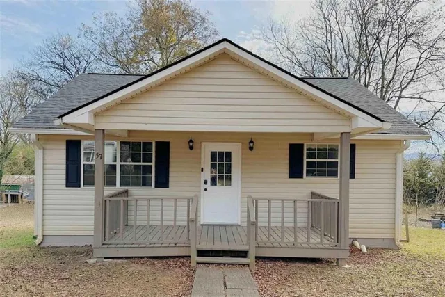 a view of a house with a small garden