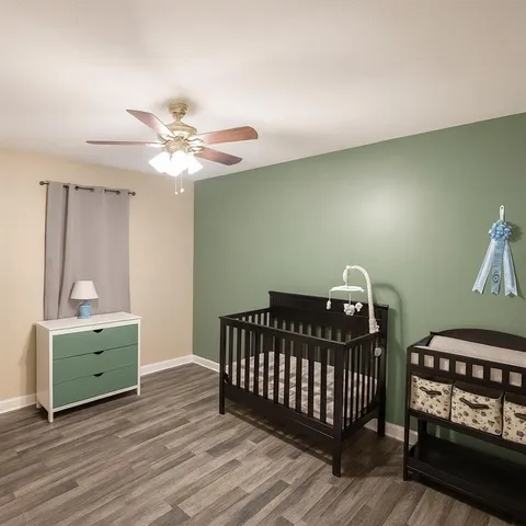 a bedroom with furniture and a window
