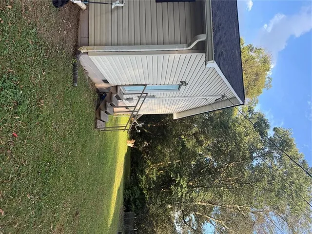 a view of outdoor space with deck and yard