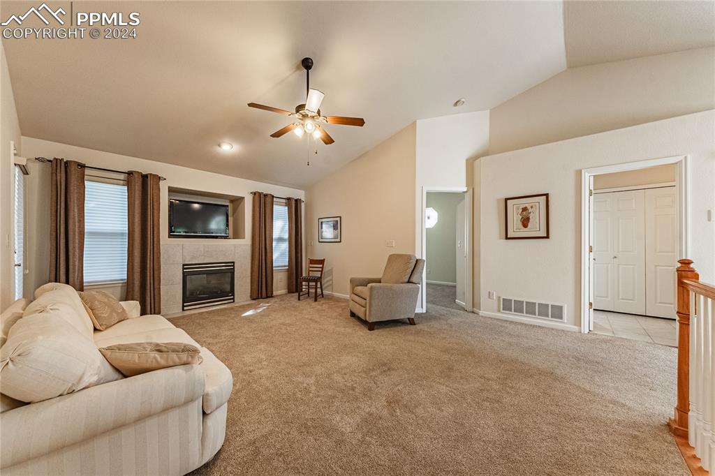 5148 Peak Villa Heights Colorado Springs, CO 80917 - Photo 12 of 45 Living room with gas fireplace
