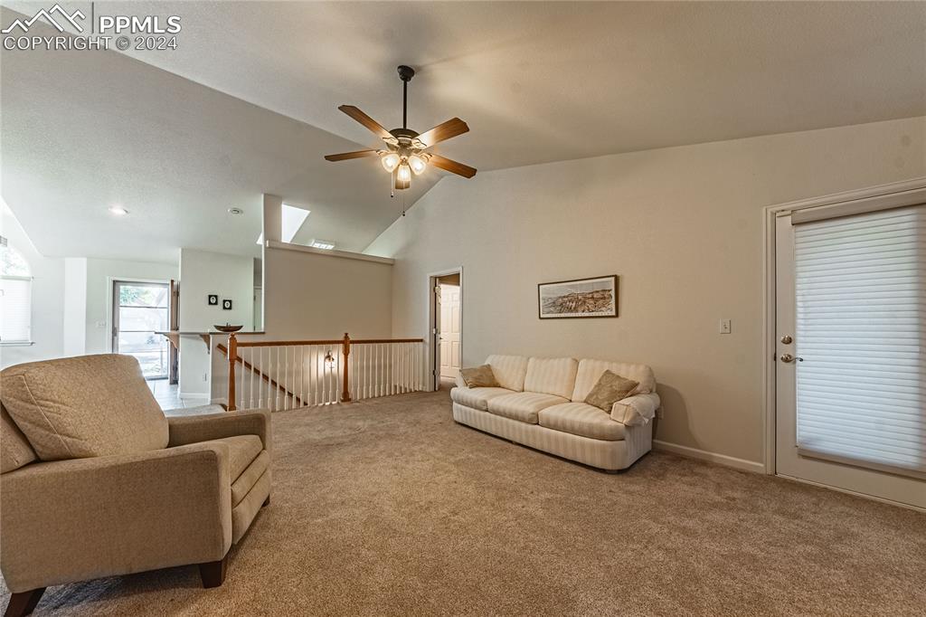 5148 Peak Villa Heights Colorado Springs, CO 80917 - Photo 13 of 45 Living room access to private deck